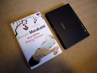 Asus Eee PC and a hardback novel