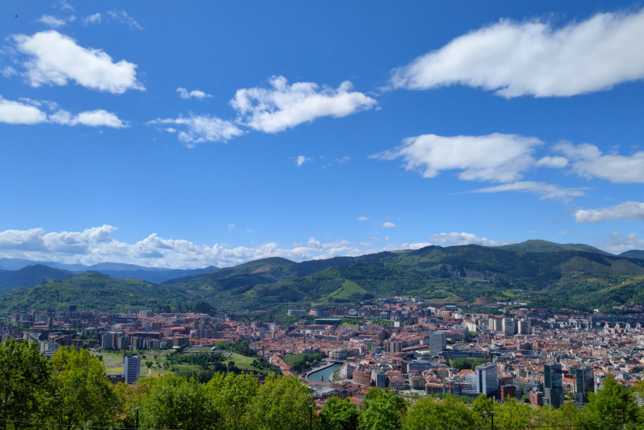Bilbao, the river, and the mountains behind, as seen from a hill above the
city