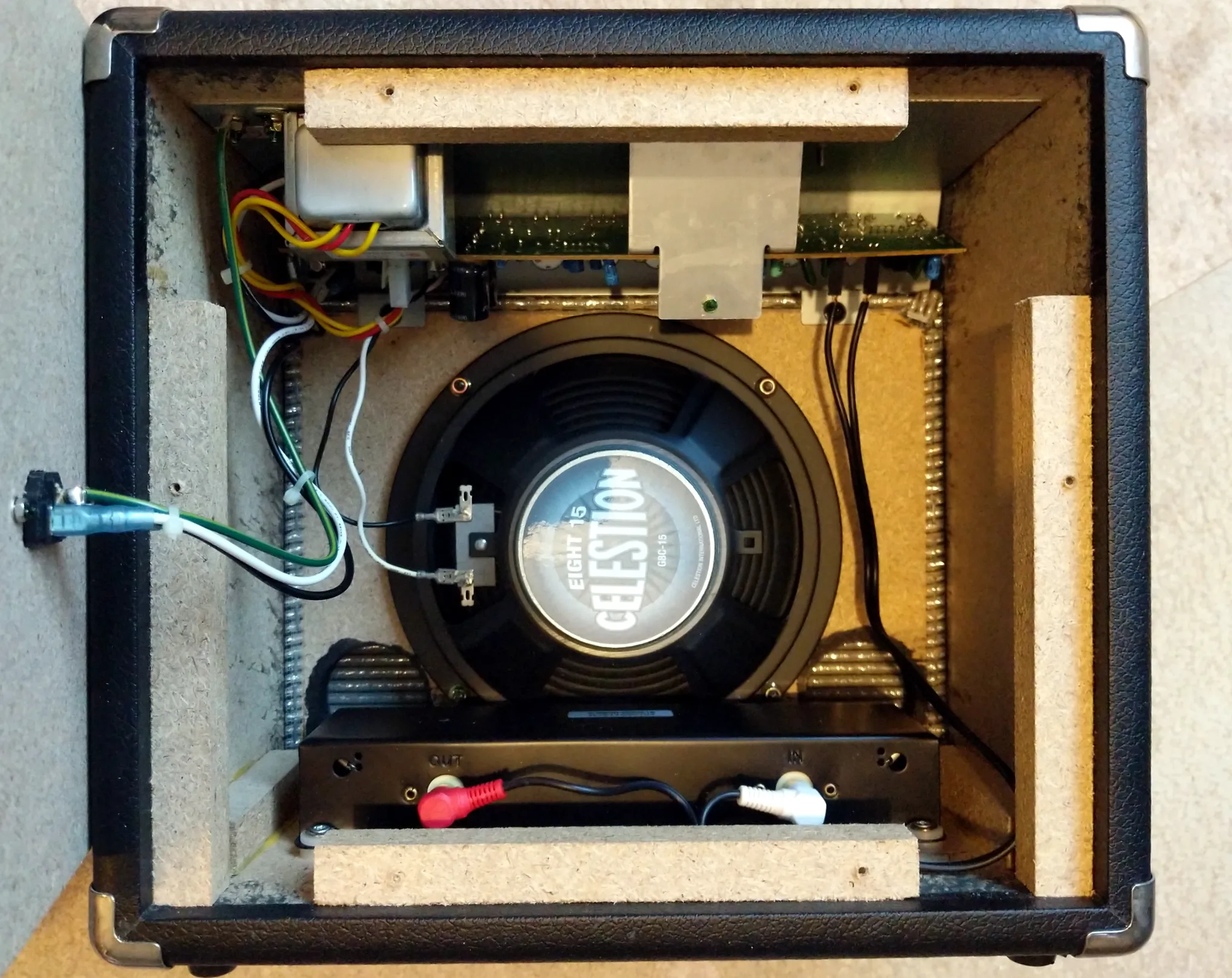 A view of the inside
of the amplifier with the new speaker. The reverb tank is installed on the
bottom, just behind the speaker.