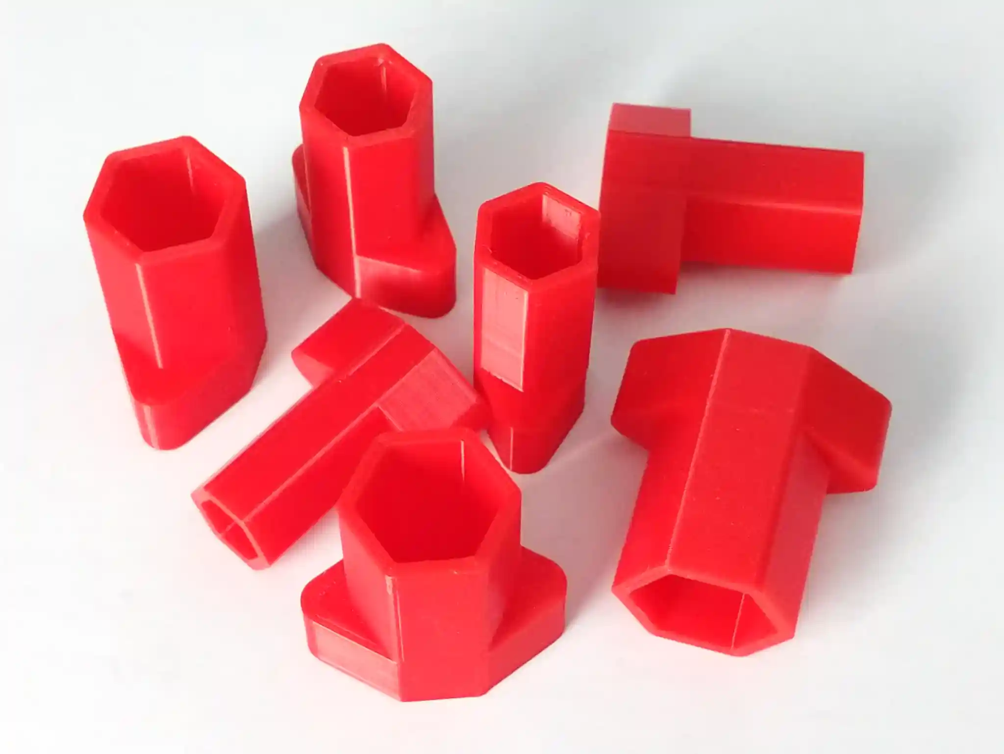 A collection of hex sockets for handheld use, printed in red PLA
