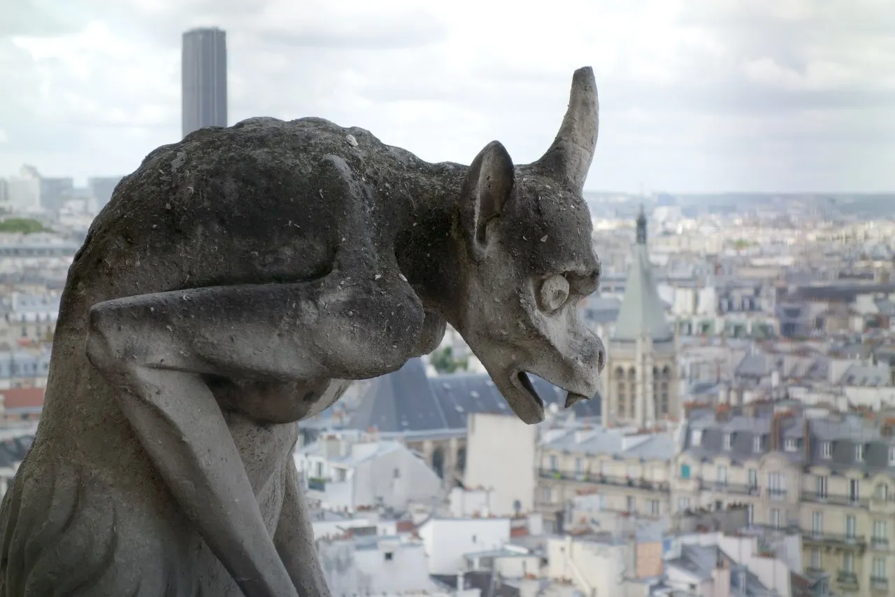 Notre Dame monstre with horrified expression looking over Paris