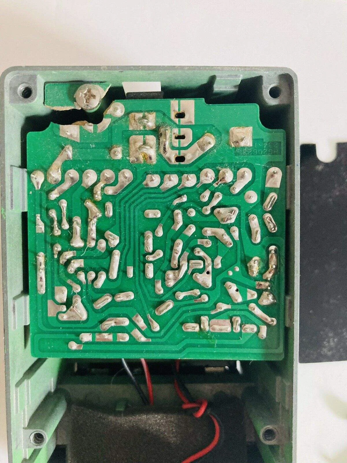 An effects pedal PCB. The corner has been snapped off where it is screwed to the case