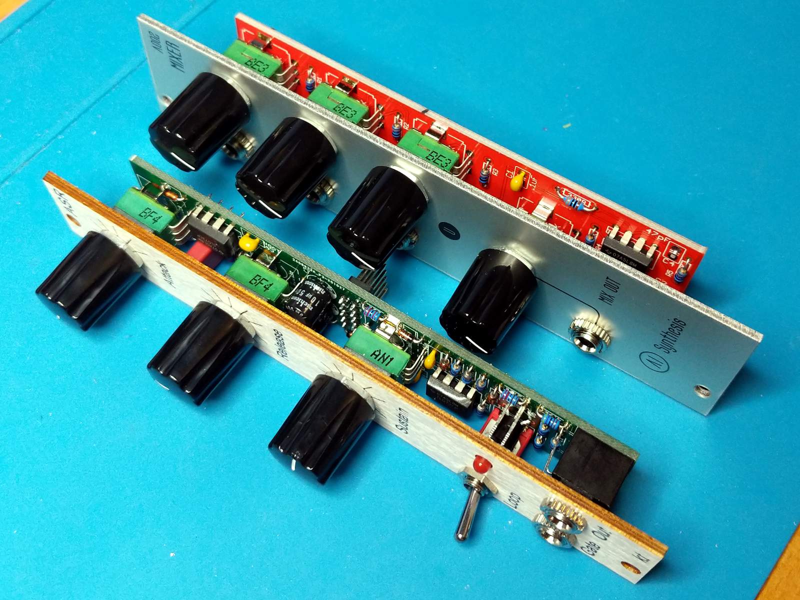 Two Eurorack modules sitting on a workbench